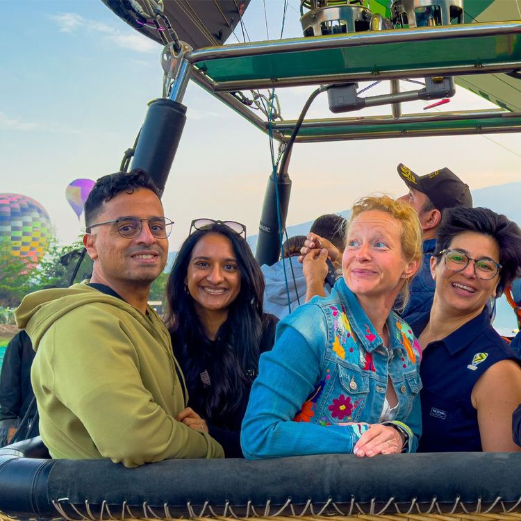 A hot air balloon with multiple peoples in it